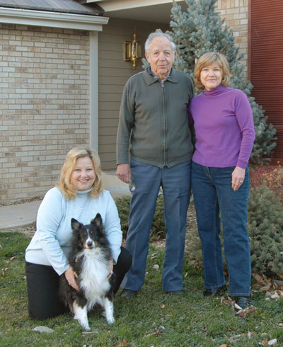 Belinda Icenhower with sons Andrew (sitting) and Isaak enjoy their organic front yard, which is filled with native, drought-resistant plants.